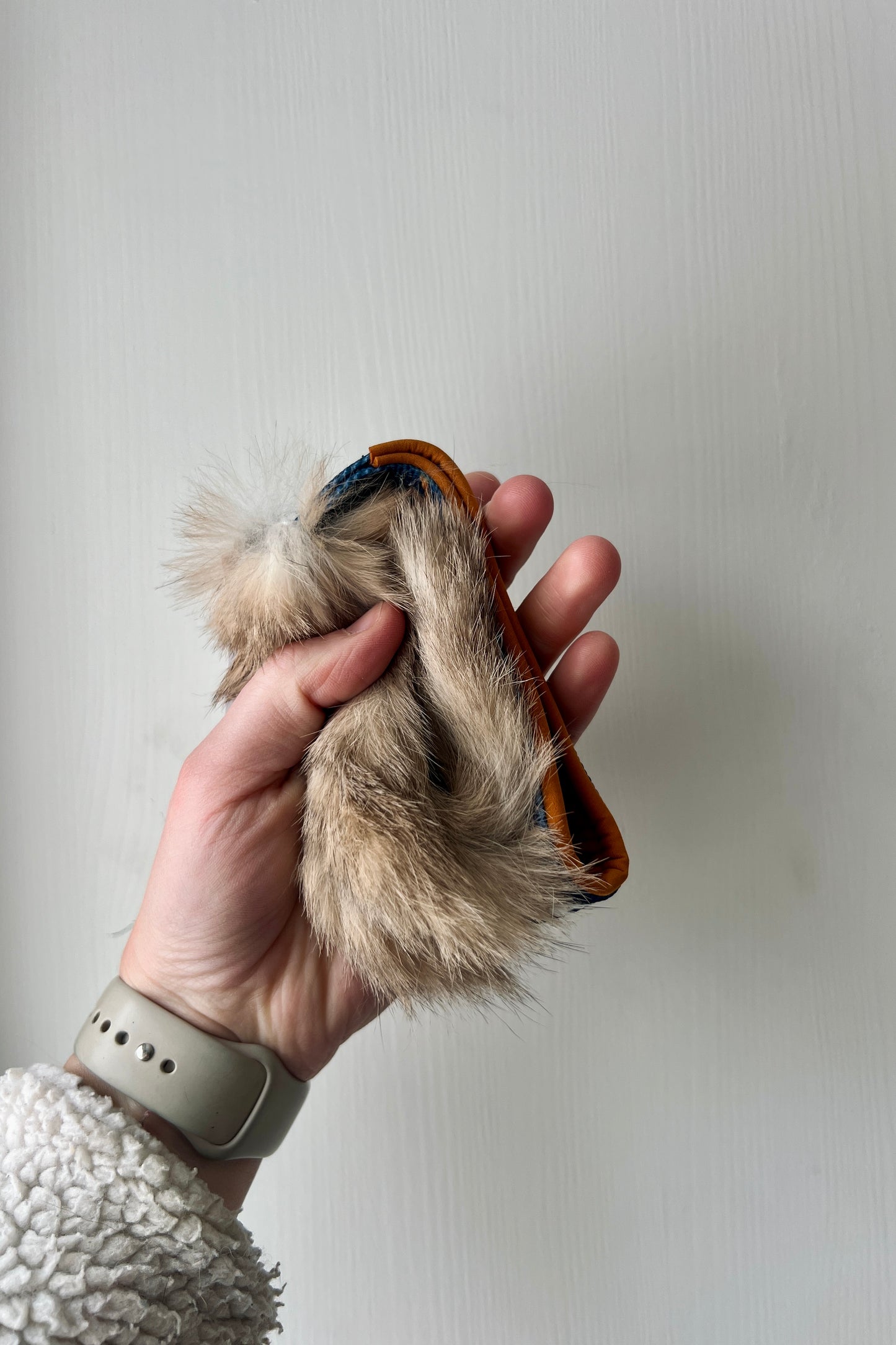Rabbit fur pocket tug with handle